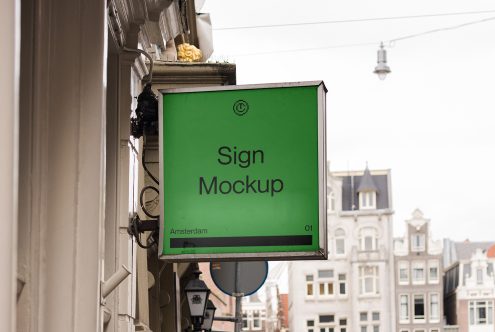 Urban sign mockup on building exterior, ideal for branding presentation, cityscape background, design asset for graphic designers.